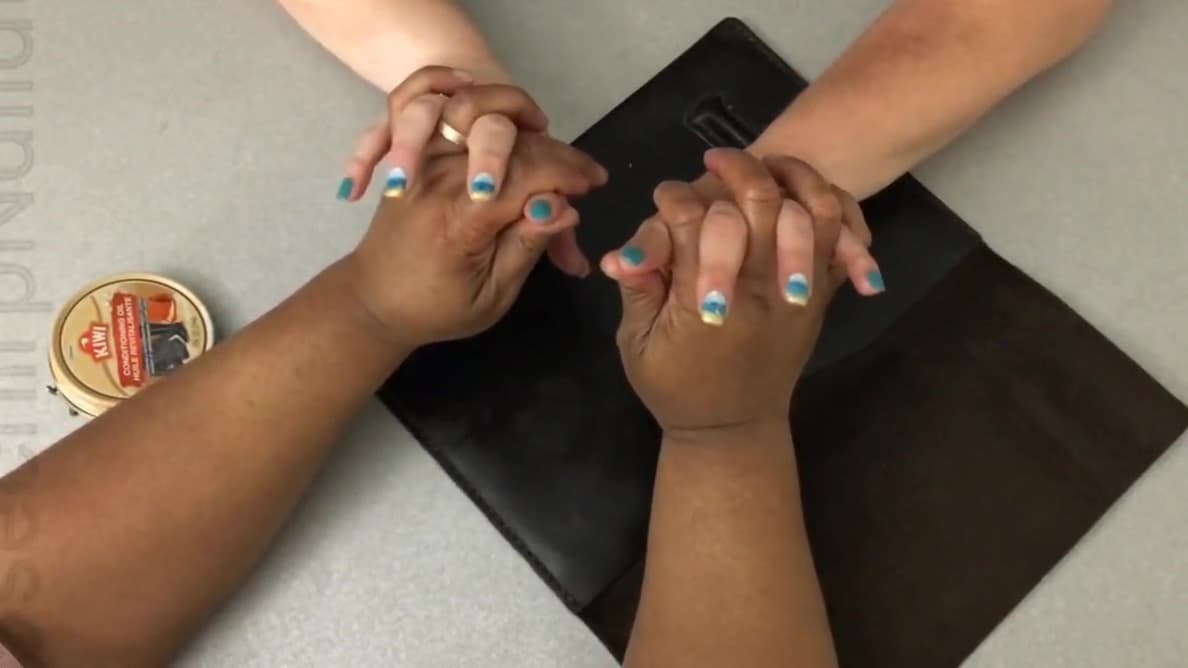 My coworker helps me with lubricating my leather case._main_thumbnail